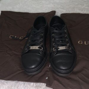 Worn Black Gucci sneakers